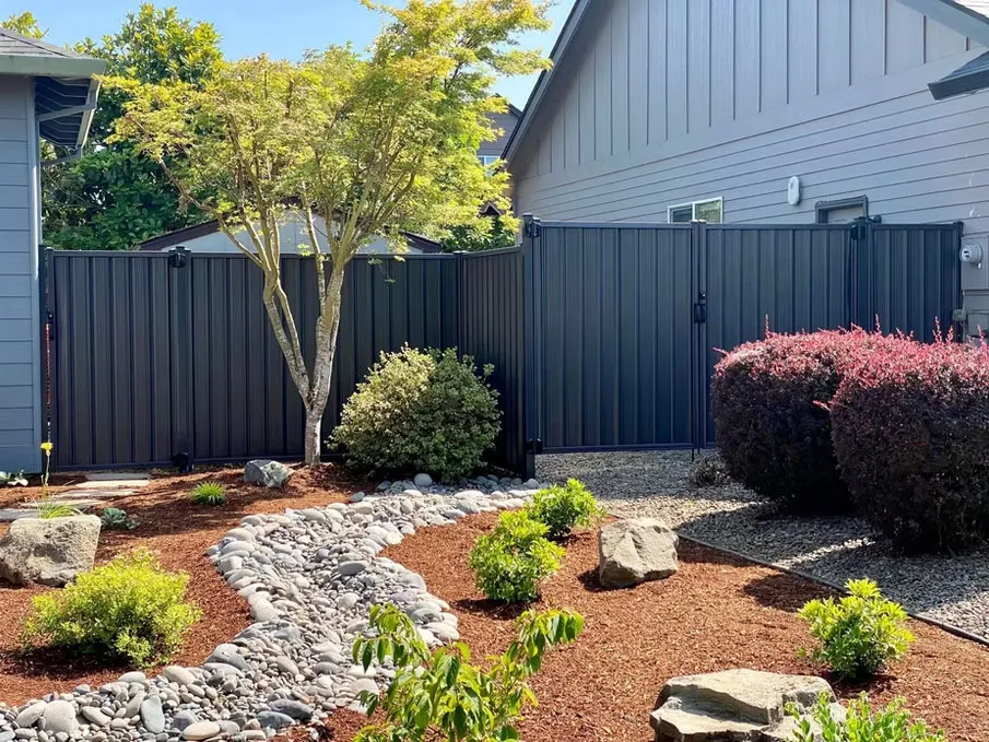 Six-foot metal privacy fence installed around a residential yard