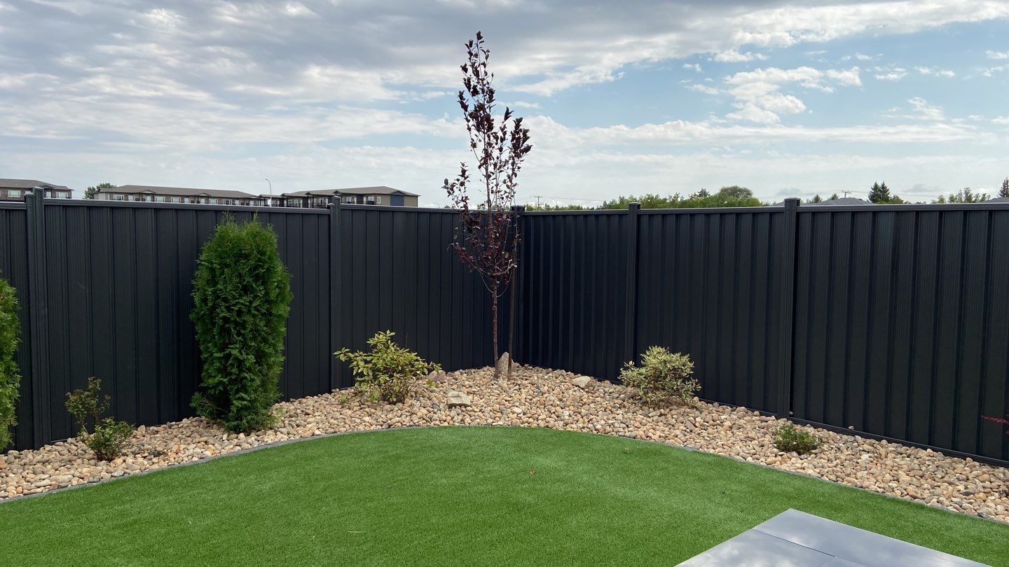 Finished metal privacy fence installation