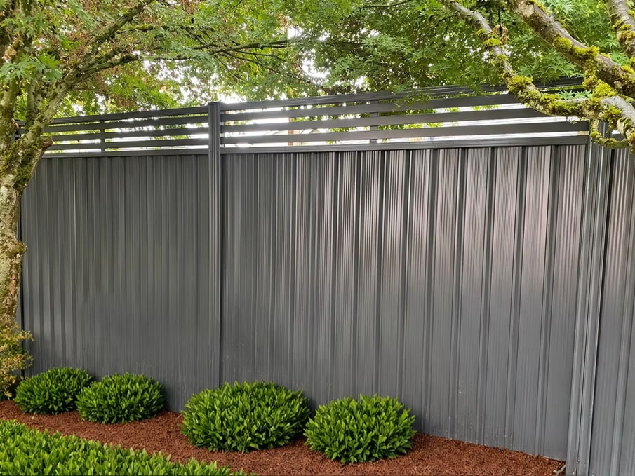 Six-foot steel privacy fence panels installed as a complete metal fence system